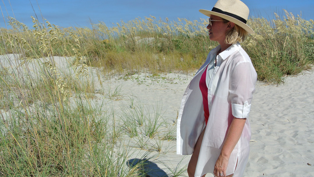 white button down cover up on beach dunes