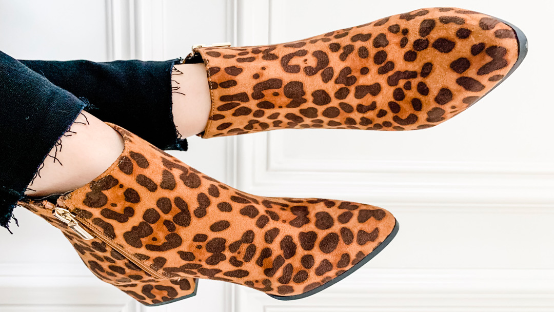 Leopard print boots with black jeans
