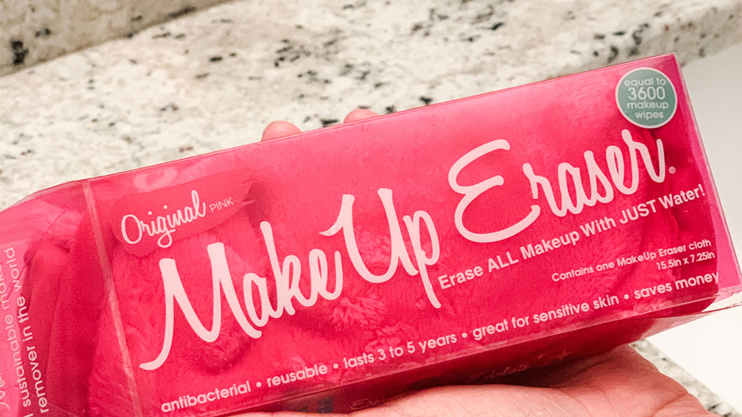 MakeUp Eraser pink box held in hand over counter