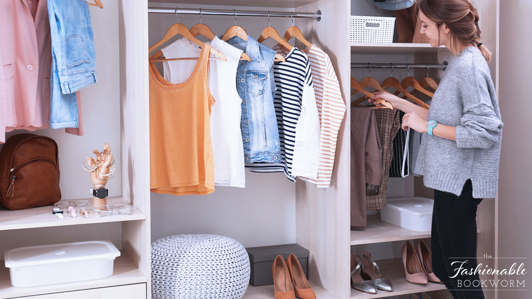 The Fashionable Bookworm - young woman choosing outfit from large wardrobe closet with stylish clothes, shoes and home accessories